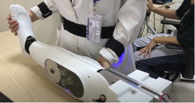 medical education task trainer. white robotic calf and foot that provides haptic feedback.