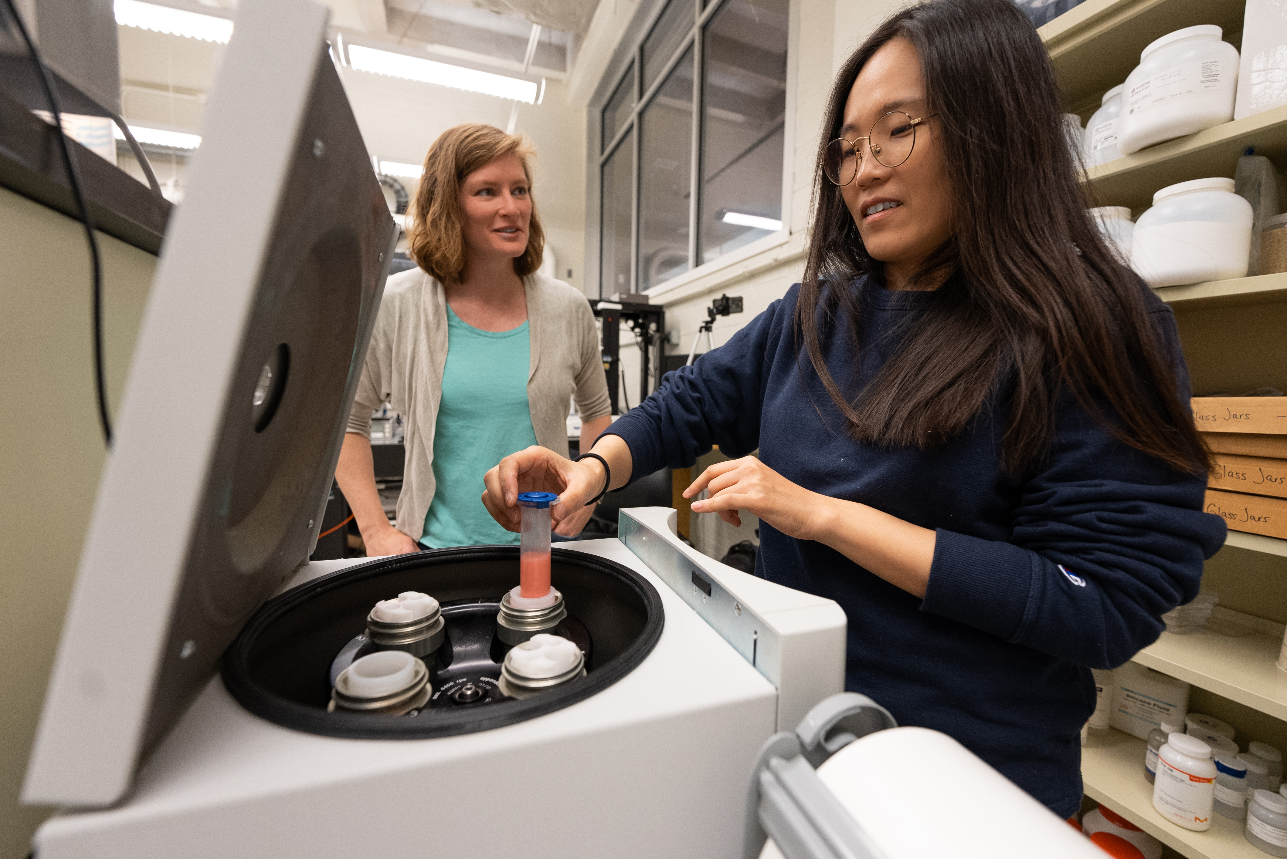professor with graduate student in a research lab