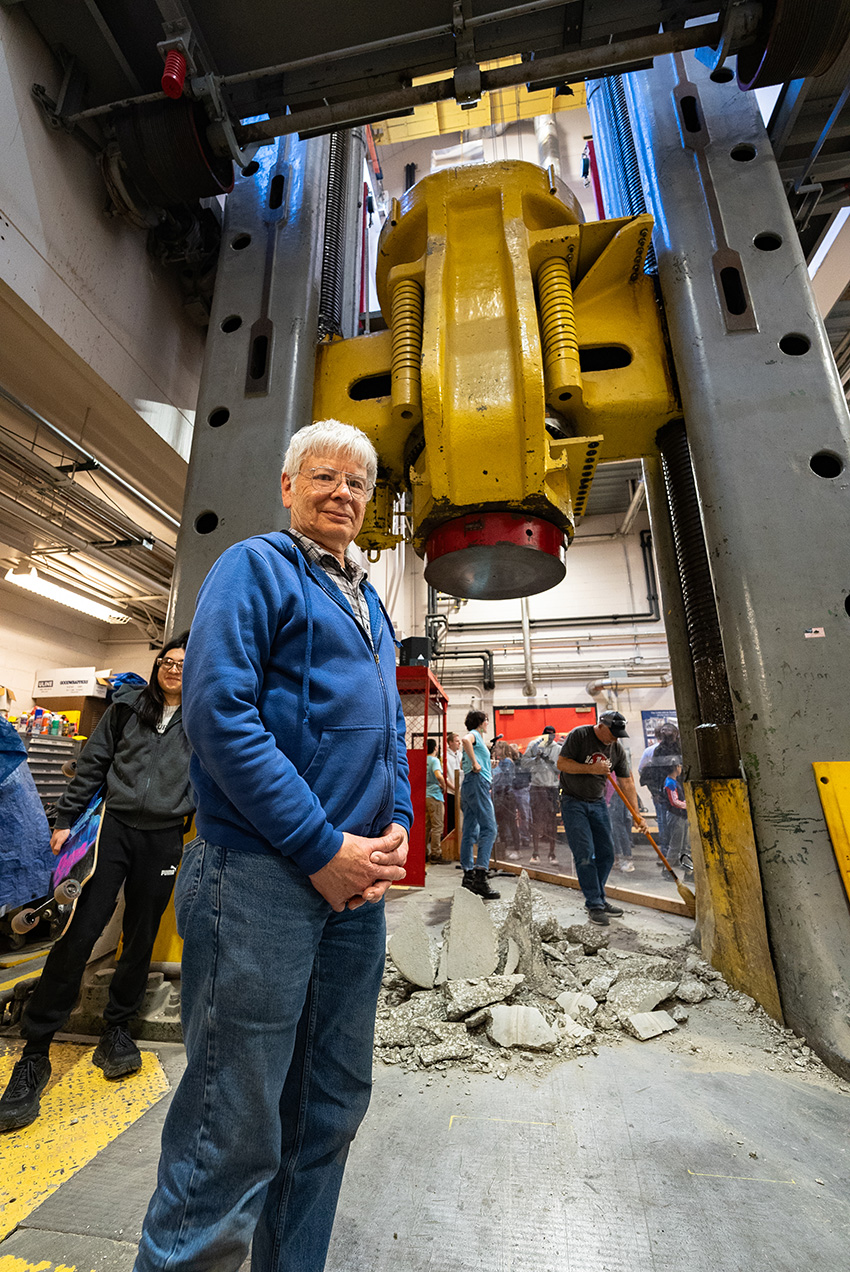 Jim Phillips standing in front of the three-million-pound testing machine