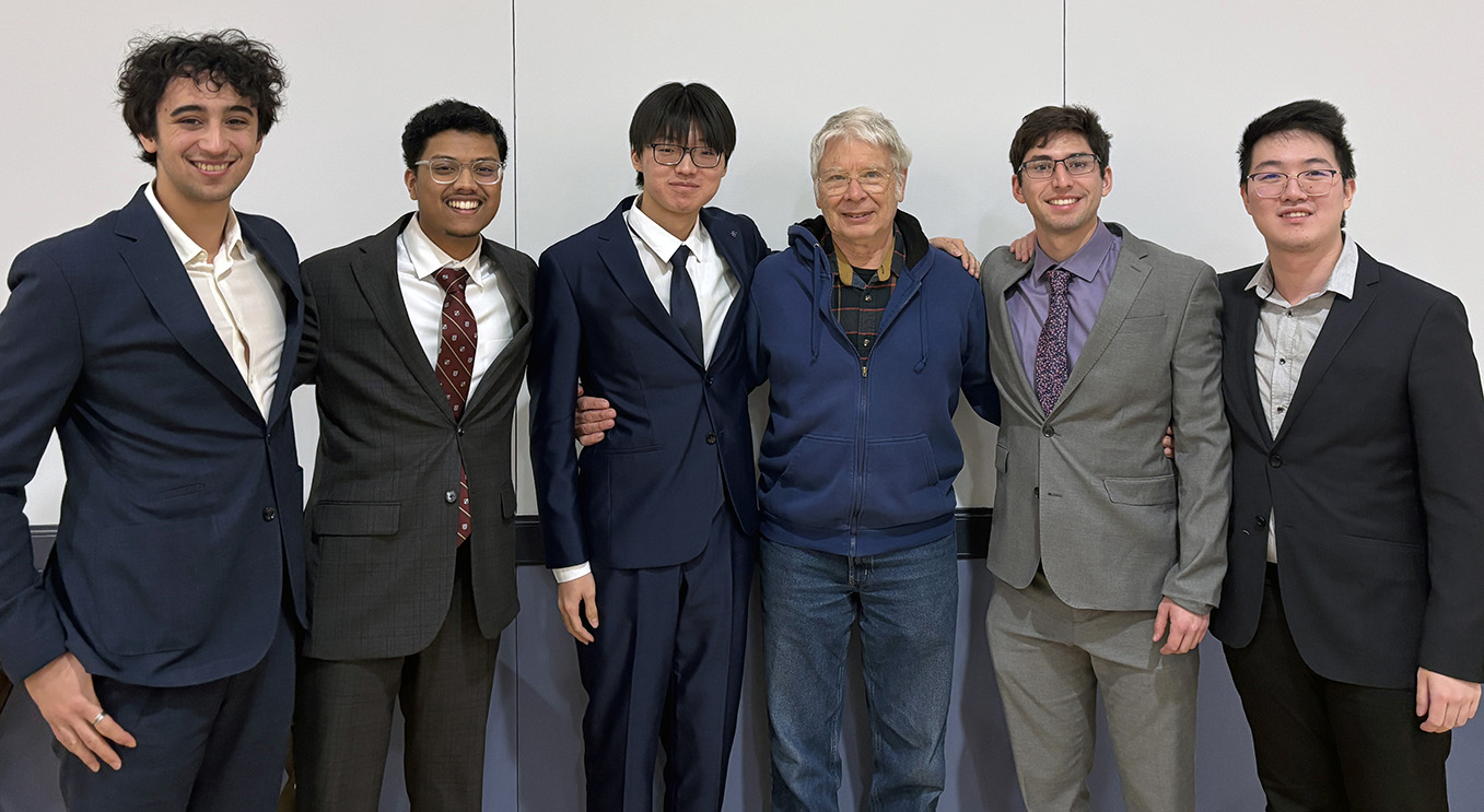 five male students with Jim Phillips center.
