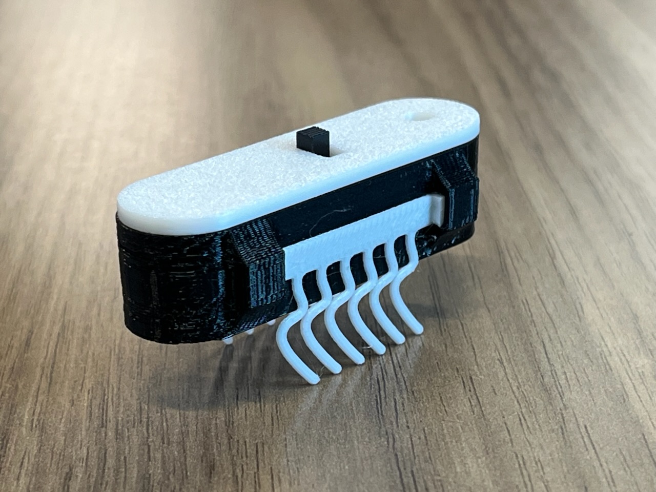 prototype of the bristle bot. black and white colored.
