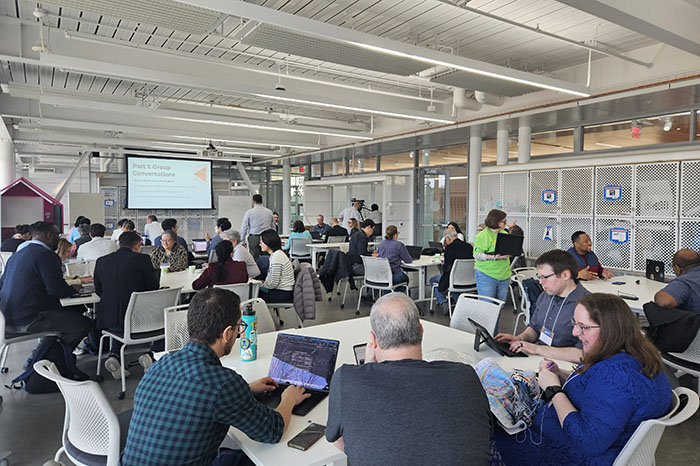 groups of people at tables having small group discussions