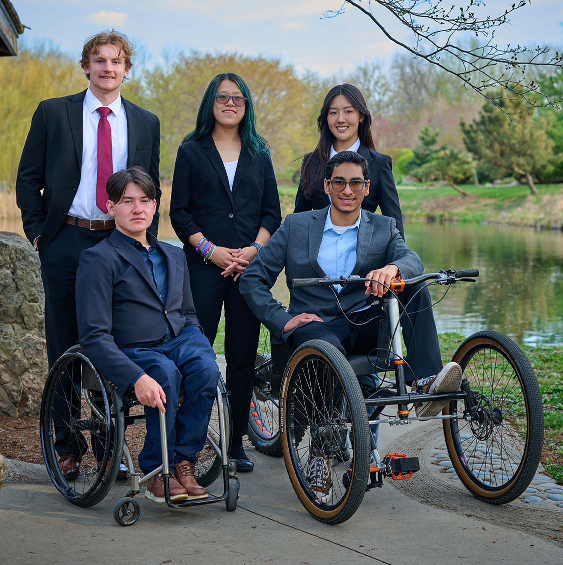 Thatcher Beauchamp, Josh Anderson, Grace He, Ivy Yoon, Adam Syed with their adaptive bike.