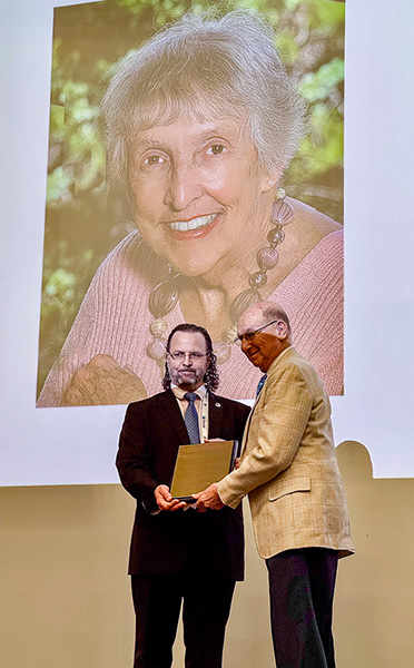 Jon Liebman accepts the Hall of Fame award on behalf of Judith Liebman. Vienna, July 2026.