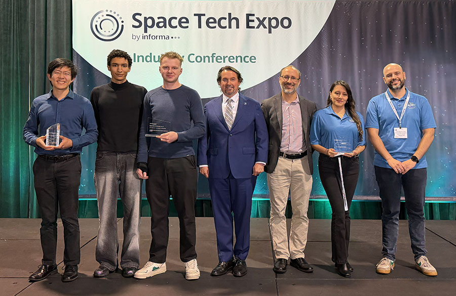 Justin Yim, left, with other finalists, standing holding their awards
