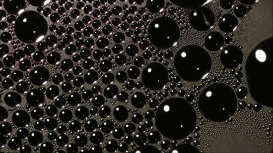 CLICK TO VIEW DYNAMIC IMAGE. A time-lapse series of photos showing the growth and coalescence of water droplets on a newly developed specialized condensation surface. Courtesy of Nenad Miljkovic.
