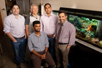 Illinois researchers developed a tiny thermometer to take fast temperatures inside of cells. Pictured, from left: Postdoctoral researcher Jeffrey Brown; Rhanor Gillette, emeritus professor of molecular and integrative physiology; Sanjiv Sinha, professor of mechanical science and engineering; Daniel Llano, professor of molecular and integrative physiology. Front row: graduate student Manju Rajagopal.  Photo by L. Brian Stauffer