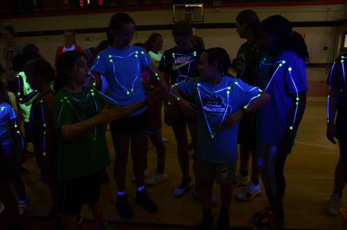 Camp participants learned about motion capture with black light tape and dots that highlighted their joints and muscles. (Photo by Elizabeth Renee Livingston)