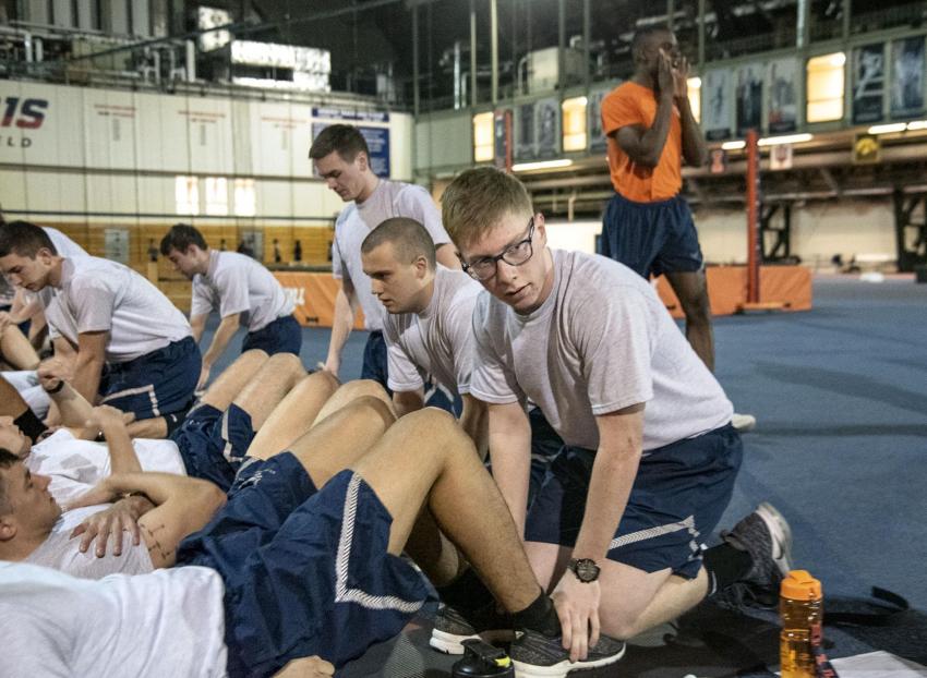 Ryan Nixon, who recently finished his freshman year enrolled in Mechanical Science and Engineering, pairs up with a fellow Air Force ROTC cadet for early morning physical training (PT) at the UI Armory earlier during spring semester.