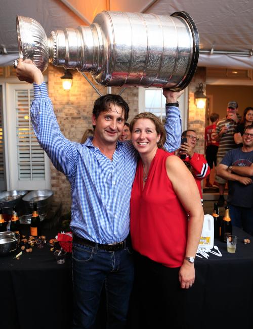 Dr. Michael Terry with wife Lynne (BS Accounting â€™94) celebrate the Blackhawks' Stanley Cup victory. Photo courtesy of Michael Terry.
