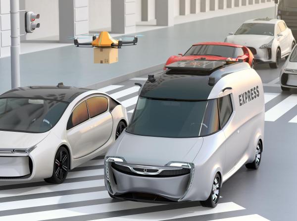 In the future, drones carrying packages could descend on a ride-sharing vehicle and magnetically dock a package to the roof of the vehicle (Photo Credit: iStock, by Getty Images).