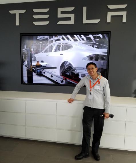 Grad student Peter Jang met with representatives from Tesla during the workshop.