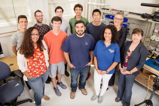 The University of Illinois click beetle robotics team. Front row, from left: Professor Aimy Wissa, Aidan Garrett, Luis Urrutia, Ophelia Bolmin and professor Alison Dunn. Back row, from left: Isandro Malik, Xander Hazel, Robert Chapa, Harmen Alleyne, Chengfang Duan and research scientist Marianne Alleyne. Garrett, Malik, and H. Alleyne are University of Illinois Laboratory High School students.