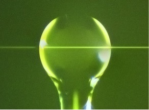 Microscope image of a silica glass resonator and optical fiber waveguide. Light and sound circulating in this type of resonator are shown to exhibit chiral effects in this study.