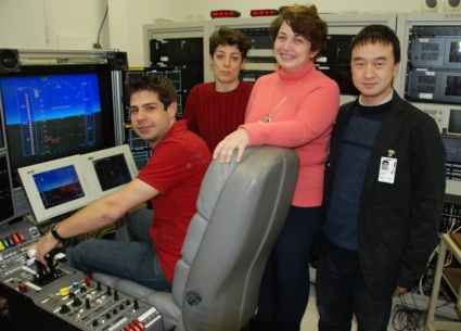 From left to right: Enric Xargay, Irene Gregory, Naira Hovakimyan and Chengyu Cao ready for a test at the NASA Langley AirSTAR Sim Development Facility in 2011.