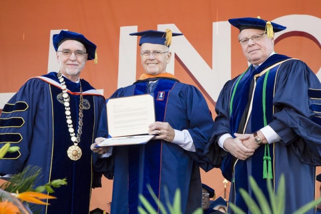 MechSE Professor Emeritus Ron Adrian (center) receives the 2017 Honorary Degree from Illinois President Timothy Killeen (left) and College of Engineering Dean Andreas Cangellaris.