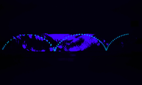 Members of SEM created a TAM demo that illustrates the path of a particle on the edge of a rolling disk using fluorescent tape and black light. 