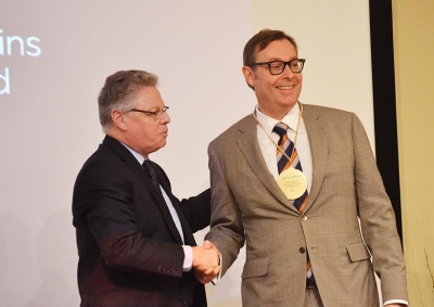 Dean Andreas Cangellaris, left, congratulates Geir Dullerud as the Wilkins Professor in Mechanical Science and Engineering.