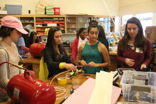 Bakalova, far right, works with University High School students.
