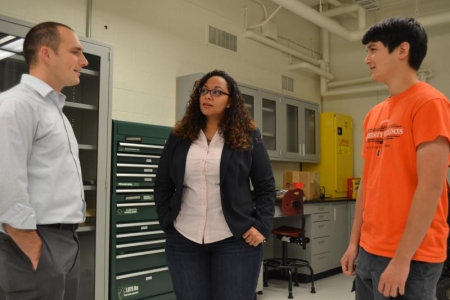 Wissa talks with two students in her research group, Josiah Waite (left) and Michael Lynch. 