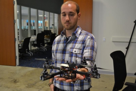 Venanzio Cichella holds a prototype of the research team's robot.