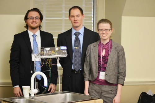 Timothy Jones, Kevin Kienitz, and Danielle Courtois with their touchless faucet prototype.