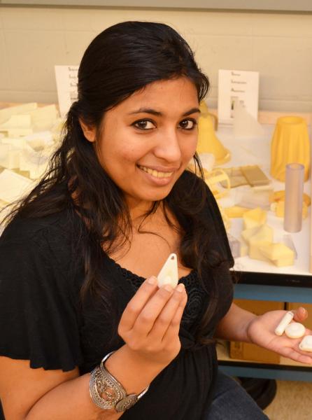 PhD student Nishana Ismail holds an early prototype of Shadow in MechSE' rapid prototyping lab.