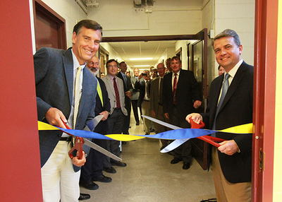 Parker Hannifin's Martin C. Maxwell and John VanBuskirk officially open the lab.