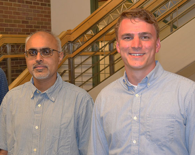 Associate Professor Prashant Mehta and MechSE grad student Adam Tilton.