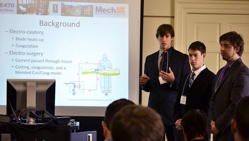 The senior design team presenting their improved electro-cautery knife.