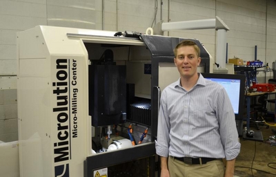 Microlution co-founder Andrew Honegger stands by one of the company's standard machine offerings.