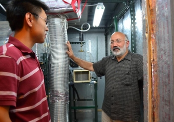 Professor Predrag Hrnjak instructs a student in one of the ACRC labs.