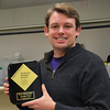 MechSE graduate student James Pikul with his Materials Research Society gold award.