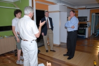 Alumni Board members Jay Althof (right) and Joe Powers (in jacket) get a sneak preview of the solar-powered house before it heads for the Solar Decathlon competition in Washington D.C.