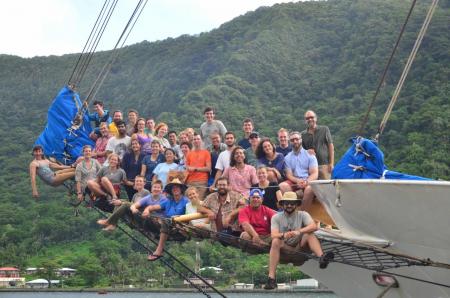 The Stanford@SEA crew, sitting on the bowsprit of the Robert C. Seamans in Pago Pago, American Samoa at the end of their voyage.