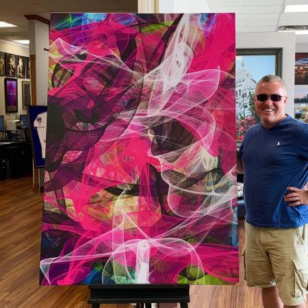 John P. Oâ€™Donnell is in his art studio with â€œ7 Flowers,â€ one of the large acrylic and ink on canvas paintings that he donated to the Beckman Institute.