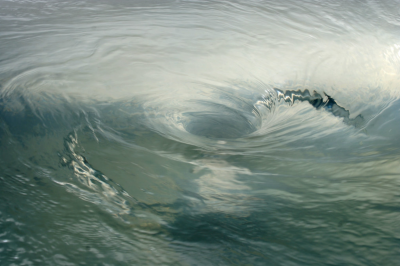 Water circling a drain outlet is a common example of a vortex, or mass of swirling fluid. Image available for reuse via Google Images.