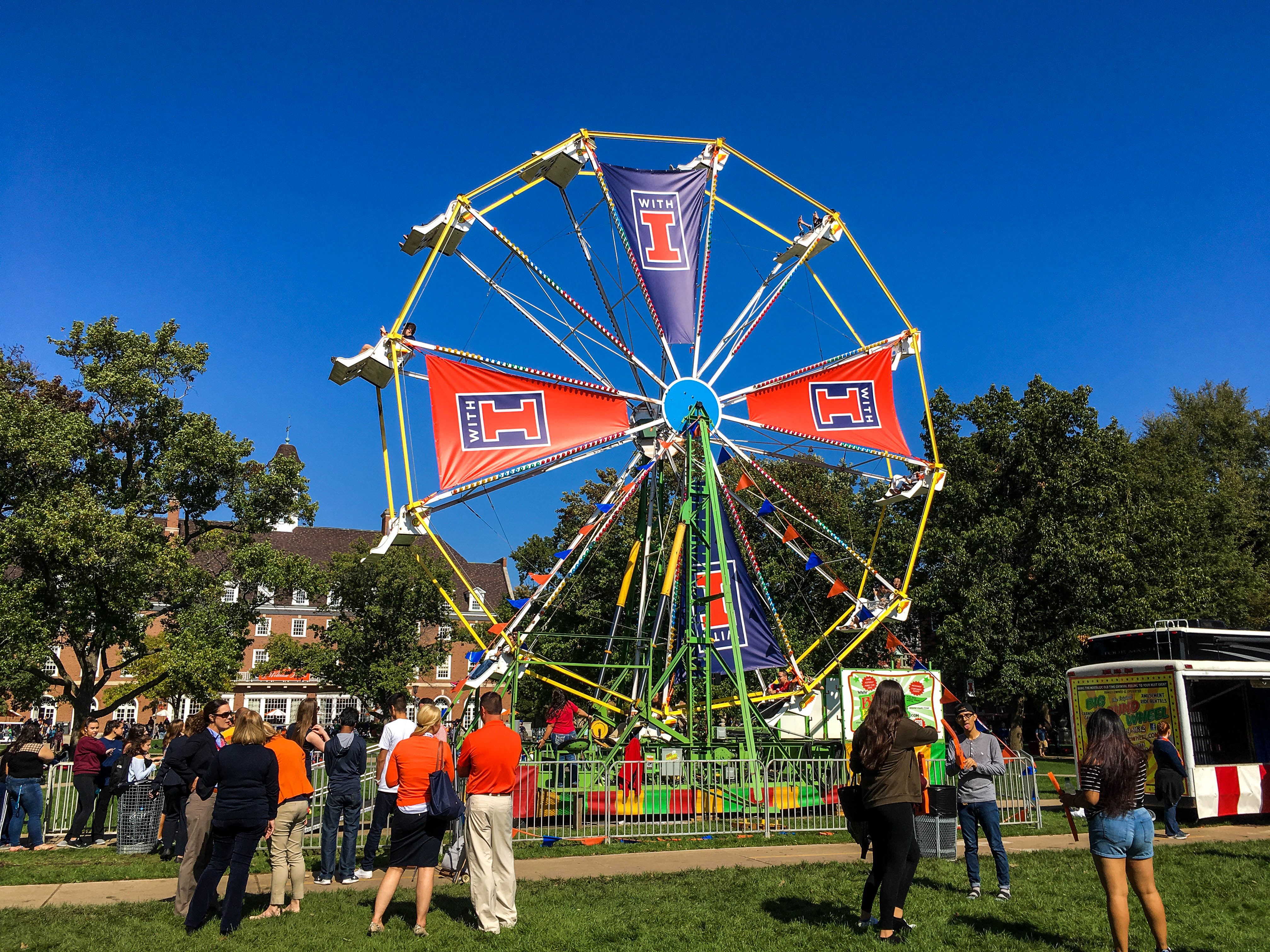 The â€œWith Illinoisâ€ campaign kicked off with a party on the quad that included a Ferris wheel and booths featuring RSOs and university departments.