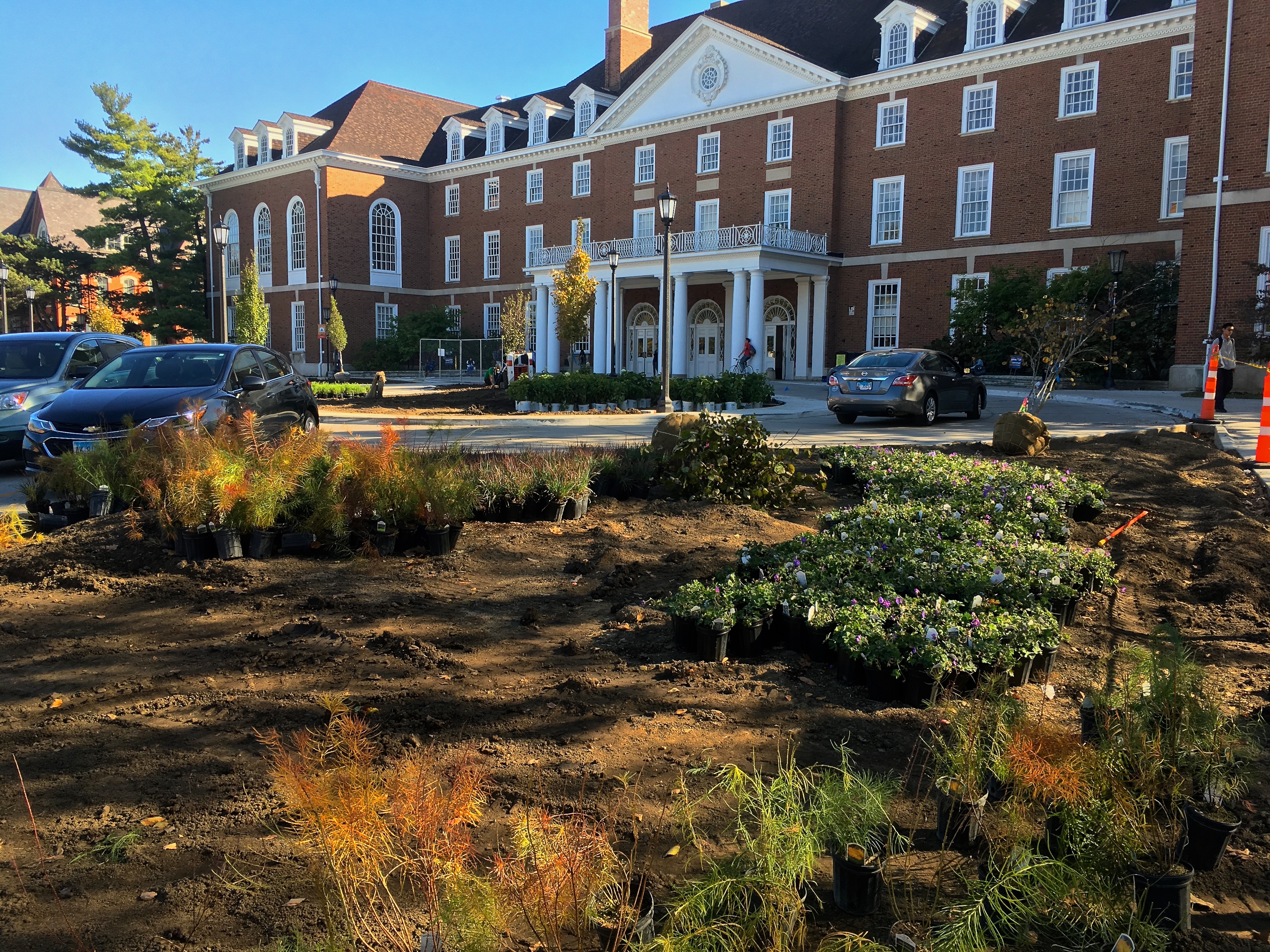 Plants are added to the new landscaping in front of the Union.