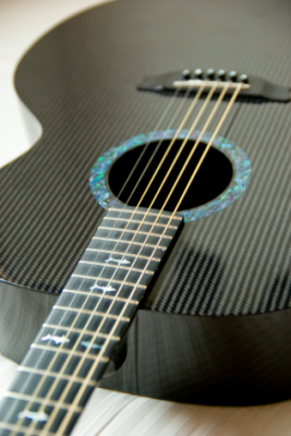 Some guitars use carbon fiber components. Carbon fiber is able to produce resonance rivaling that of traditional wood.