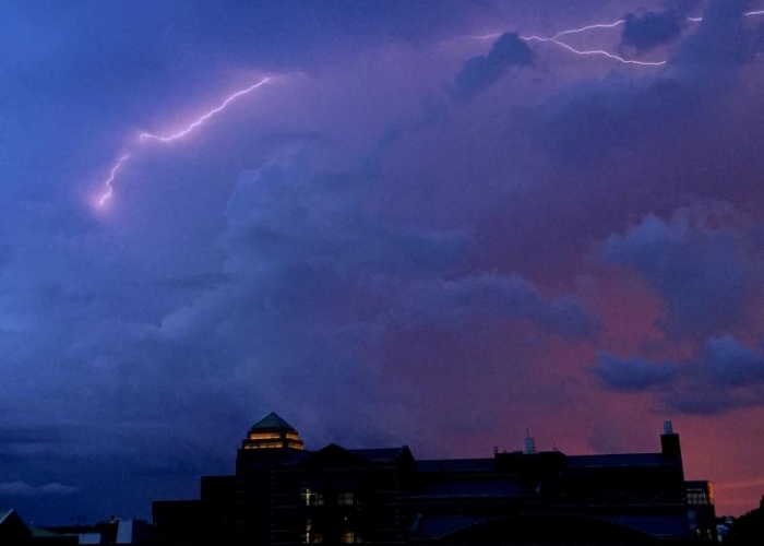 Lightning over Beckman at sunset.
