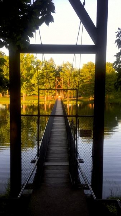 Suspension bridge over Lake of the Woods in Mahomet.