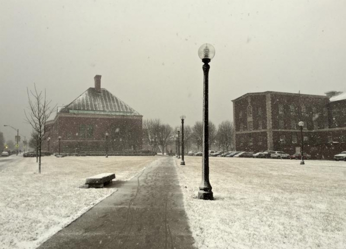 Looking at Grainger Library in the snow from the corner of Wright and Springfield.