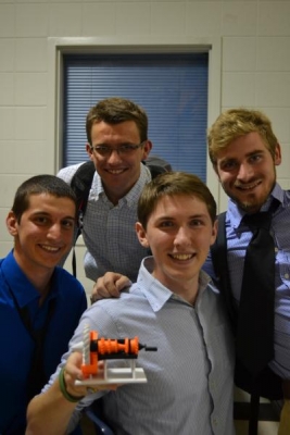 Adam Bunge, Kevin Burns, Peter Leipert, and Ian Sanders-Schneider, holding a 3D printed model, took second place for their study of a jet engine core. 