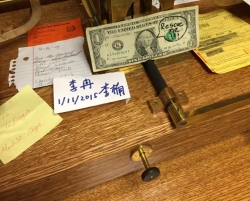 First one to open the case can rescue this dollar bill.