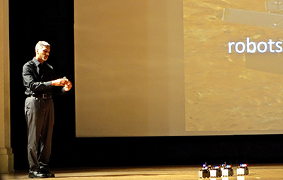 Dr. James McLurkin demonstrates his swarm robots. Photo by Taylor Tucker. 