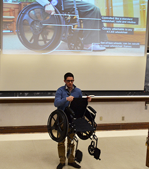 Scott Daigle demonstrates one of his company's innovative wheelchairs.