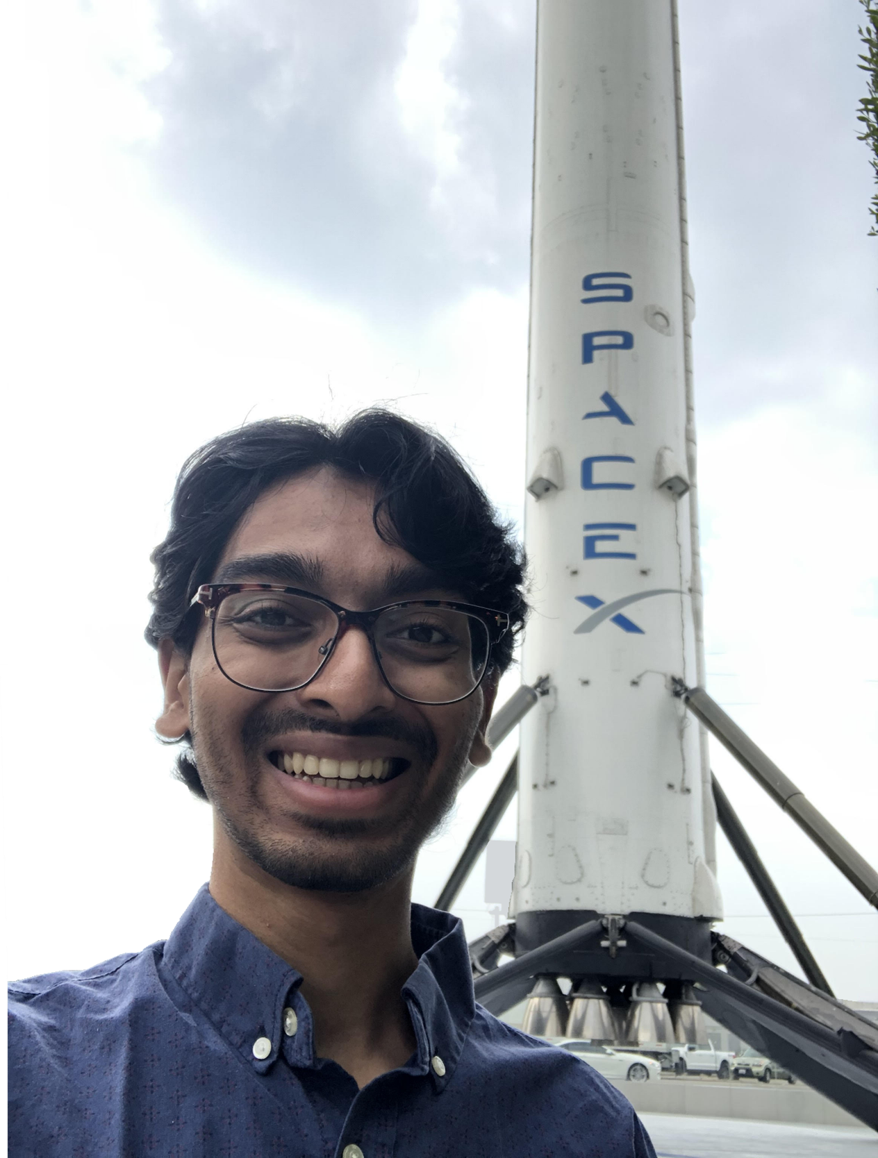 Neil Chiruvella at 1 Rocket Rd in Hawthorne, California. The rocket in the picture is a first stage for a Falcon 9 and is the first orbital rocket stage to be successfully landed for reuse. https://youtu.be/ANv5UfZsvZQ