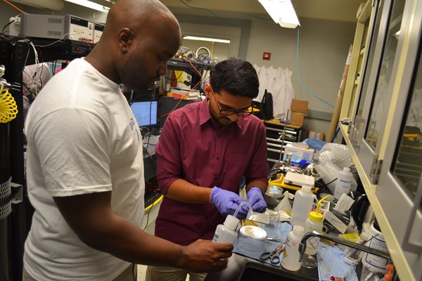 Two students working in a lab at UIUC