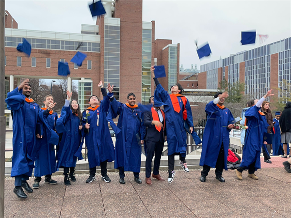 Students celebrate their graduation from the program.
